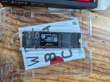 a plastic box with a memory card in it on a wooden table