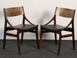pair of mid - century danish teak dining chairs with black leather upholstered seats