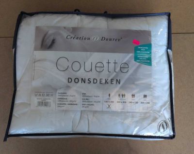 the pillow is white and has a black border around it