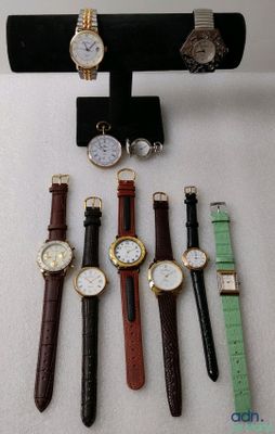 a lot of different watches on display on a table