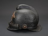a black hat with a star on it on a gray background