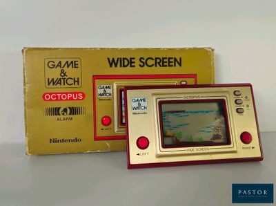 un Game & Watch posé sur la table à côté de la boîte