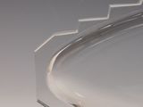 a clear glass plate with a curved design on it