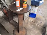 a small table with two spray bottles on top of it