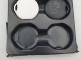 a plastic tray with two bowls and a spoon in it