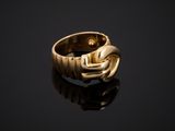 a gold ring with a snake ' s head on it