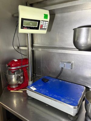 an image of a kitchen with a scale and a mixer