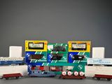 a lot of toy trains that are sitting on a table