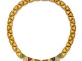 a gold bracelet with multi colored stones and diamonds