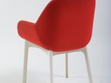 pair of red chairs with white legs against a white background