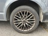 a close up of a car ' s tire on the road