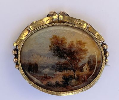 une photo d'un tableau représentant un paysage, dans un cadre doré