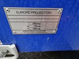 a sign on the side of a blue container