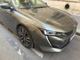 the car is parked on the side of the street in the city