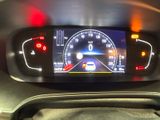 the dashboard of a car with a digital display on it