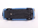 a blue toy car that is sitting on a white surface