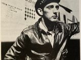a black and white photo of a man in a leather jacket