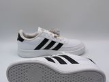 a pair of white sneakers with black and white stripes