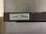 a picture of a stainless steel dishwasher with a sign on it