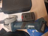 a cordless drill and a cordless tool on a table