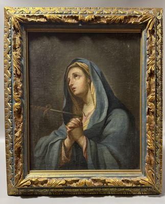 un tableau représentant une femme tenant une pipe à la main