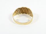 a close up of a gold ring on a white surface
