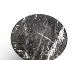 a close up of a table with a marble top on a white background