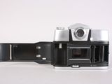 a black and white photo of an old camera