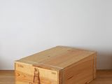 a wooden box with a wooden handle on a wooden table