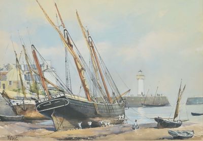 many boats that are sitting on the beach