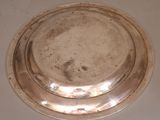 a silver plate that is sitting on a table