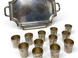 silver plated serving set with six cups and a tray