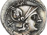 un gros plan d'une pièce de monnaie sur laquelle figure une tête romaine