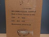 an open cardboard box sitting on top of a wooden table