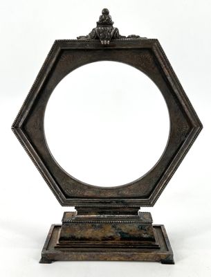 a close up of a mirror on a stand with a white background