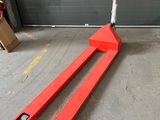 a fork and a fork on the ground in front of a garage door