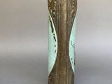 a vase that has a blue and gold design on it