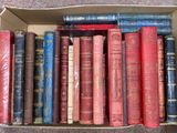 a box full of old books sitting on the floor