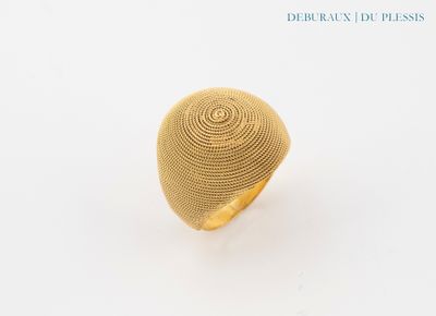 gold plated ring with a circular design on the center