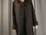 an image of a mannequin wearing a brown coat with a fur collar
