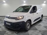 the white van is parked on a checkered floor in a room