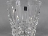 a clear glass vase with a black stripe on it