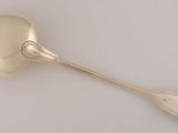 a close up of a spoon with a spoon handle on a white surface