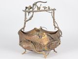 an image of a metal bowl with a bird on it