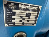 a picture of a blue machine with a sign on it