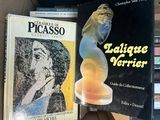 two books that are sitting in a box on a table