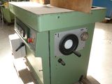 a machine that is sitting on a pallet in a warehouse