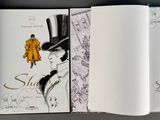 three pages of a book with drawings of women on them
