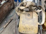 an image of a man working on a construction machine
