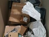 a box full of assorted items in the corner of the room